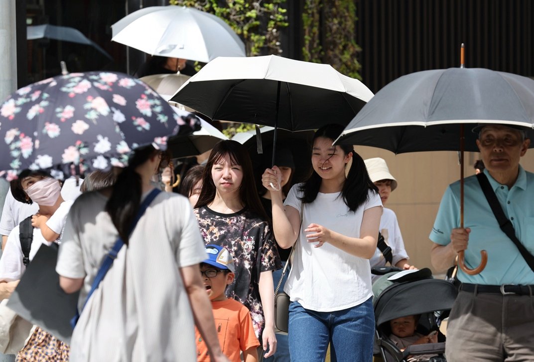 日本气象厅向多地发布“中暑警戒警报”-第1张图片